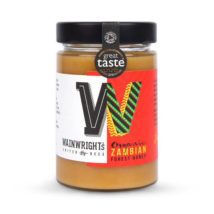 Wainwright's Organic Zambian Forest Honey with a 'Great Taste' award label on a white background