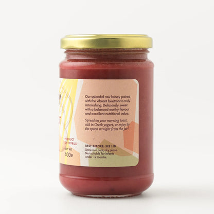Mellona Raw Honey with Beetroot in a jar showcasing its rich color and packaging details.