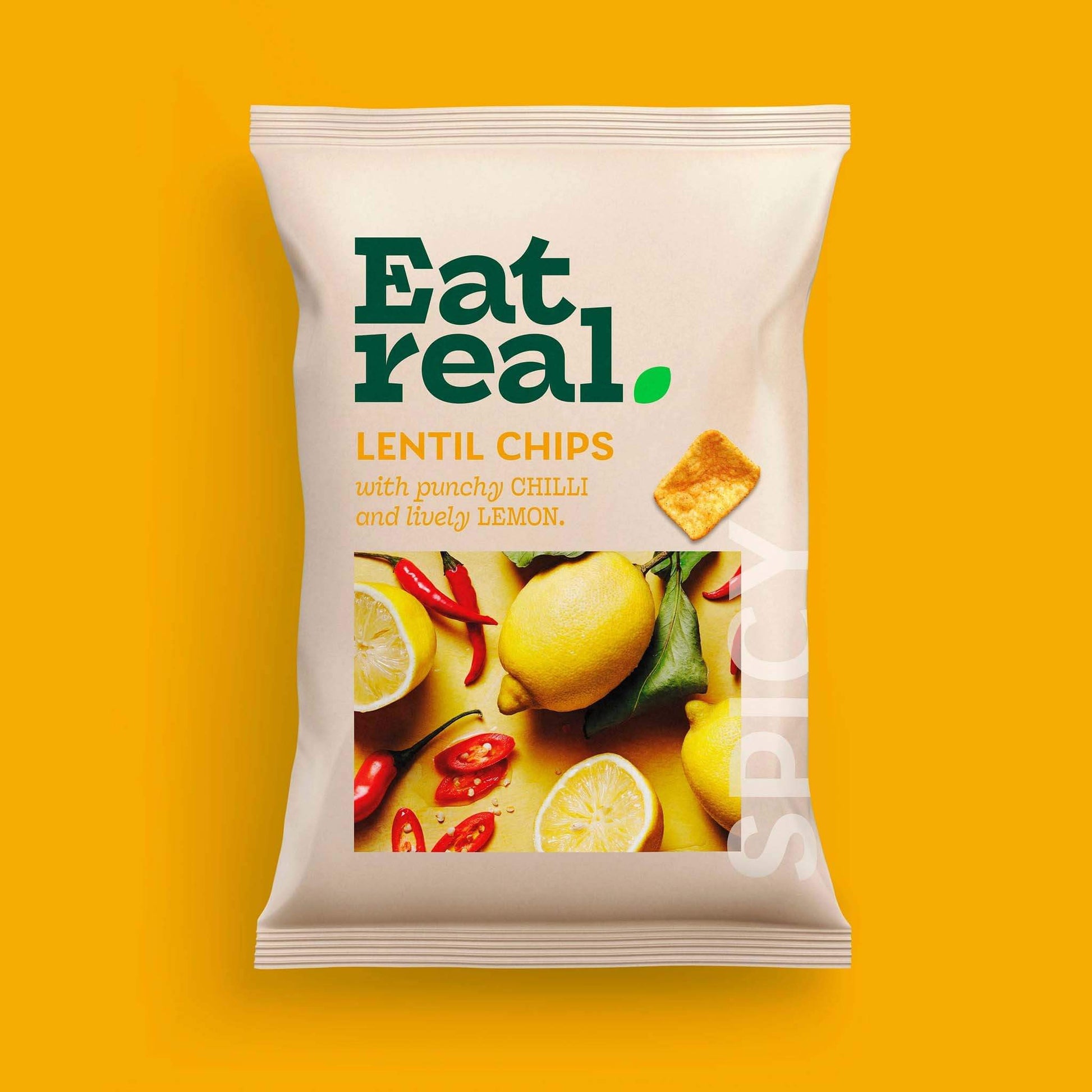 Pack of Eat Real 40g chilli & leamon flavour lentil chips on a yellow background