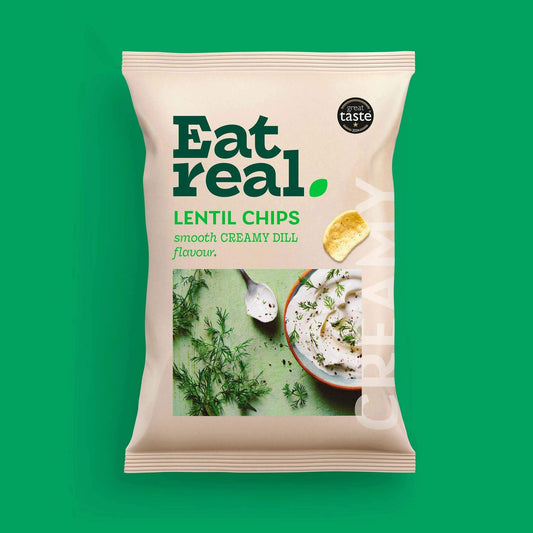 Pack of Eat Real 40g creamy dill flavour lentil chips on a green background