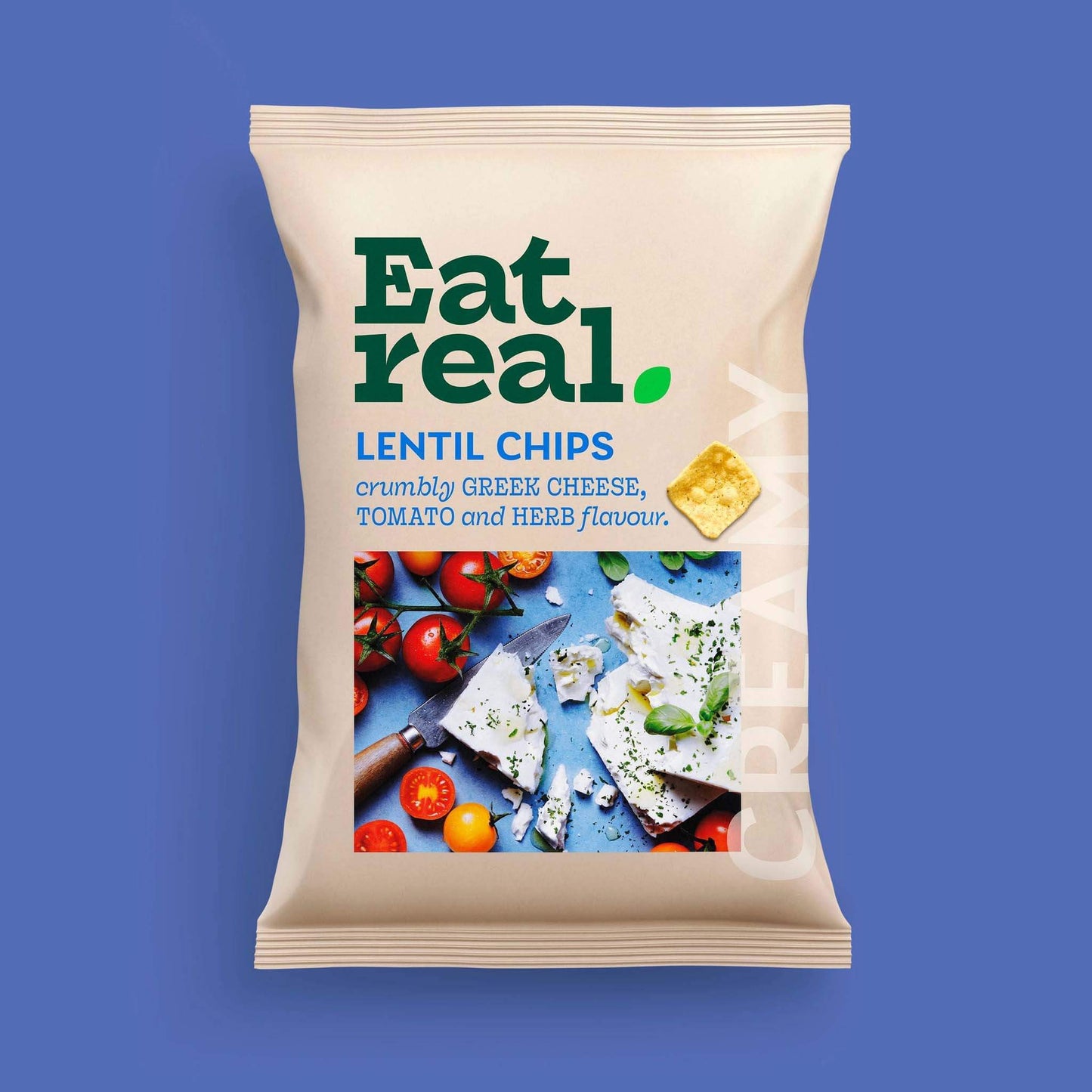 Pack of Eat Real 95g Greek cheese, tomato & herb flavour lentil chips on a blue background