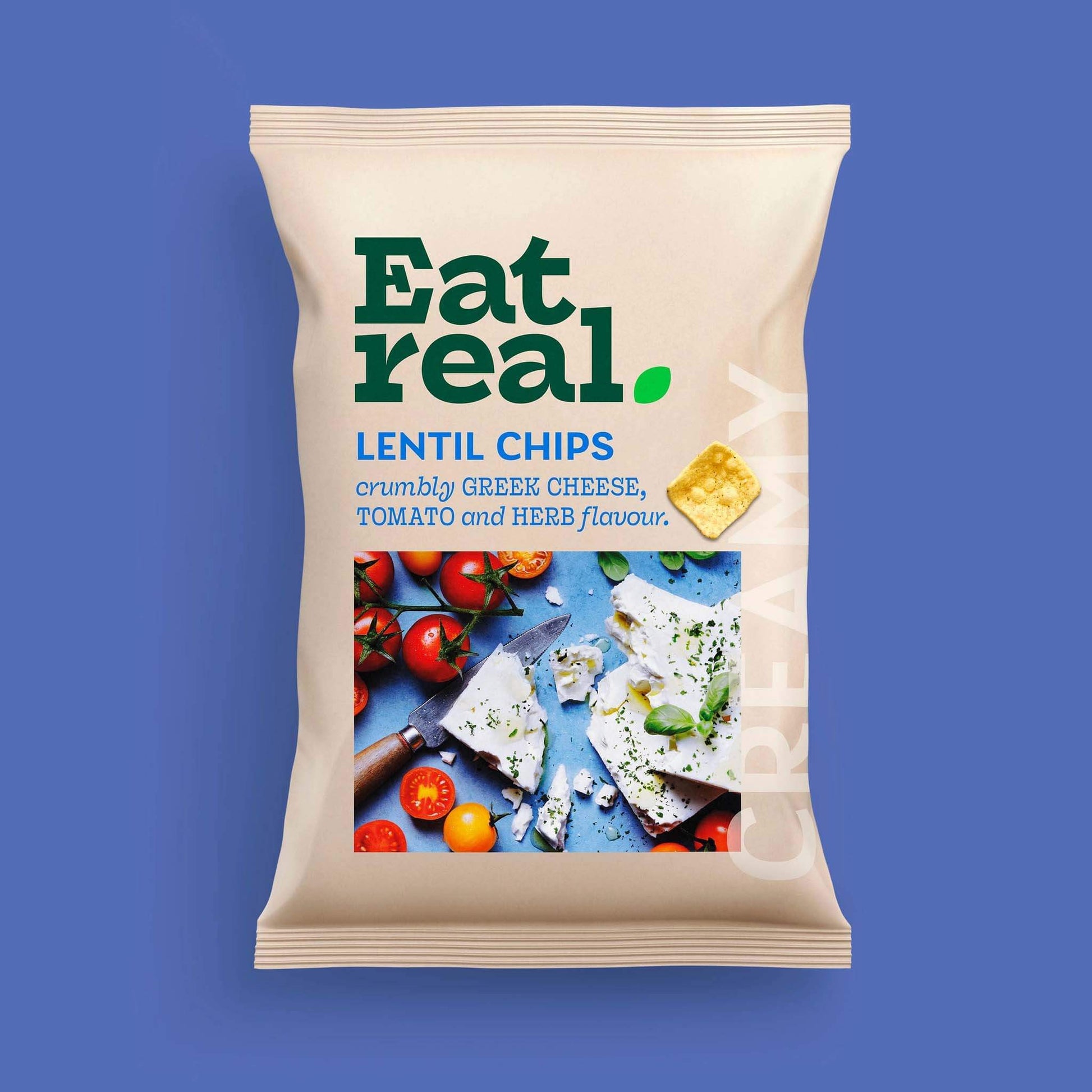 Pack of Eat Real 95g Greek cheese, tomato & herb flavour lentil chips on a blue background