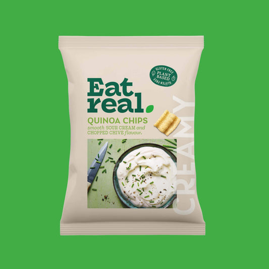 Pack of Eat Real 90g sour cream & chive floavour quinoa chips on a green background
