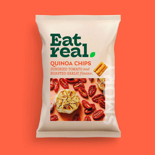 Pack of Eat Real 90g sundried tomato & roasted garlic flavour quinoa chips  on an orange background.