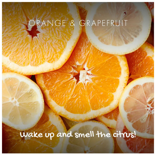 Sliced oranges and grapefruits with text overlay on a white background