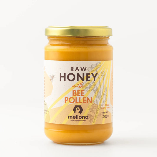 Mellona Raw Honey with Bee Pollen in a glass jar showcasing its vibrant color and organic label.
