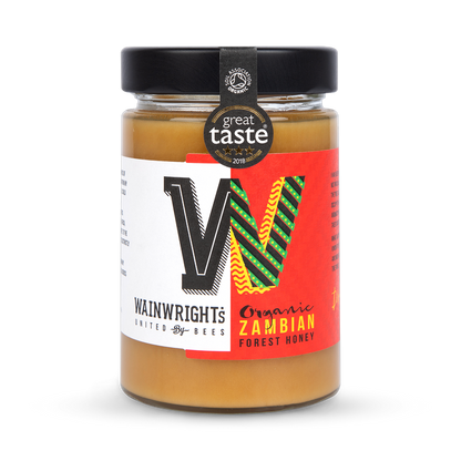 Wainwright's Organic Zambian Forest Honey with a 'Great Taste' award label on a white background