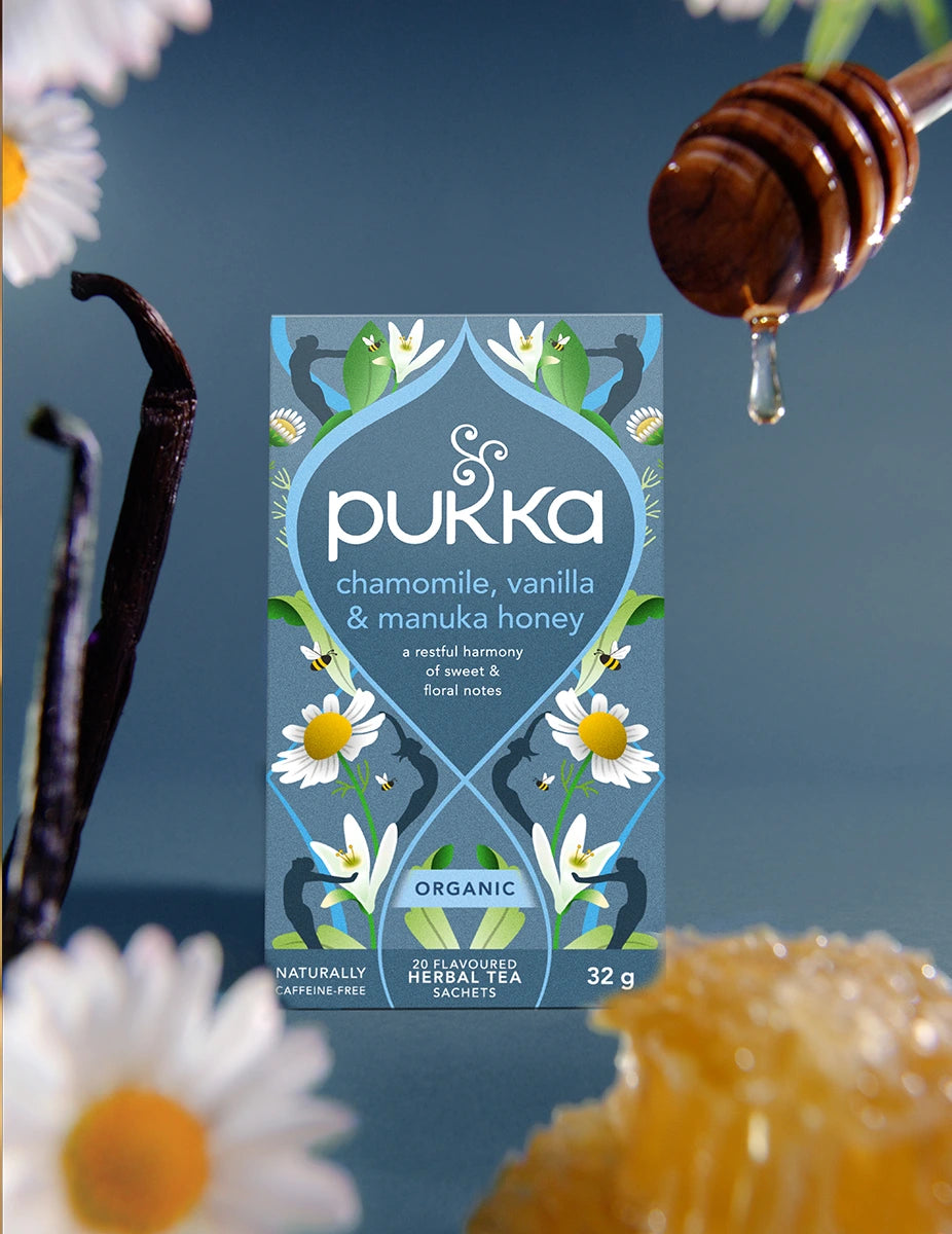 Pukka Chamomile, Vanilla & Manuka Honey tea box with brewed cup
