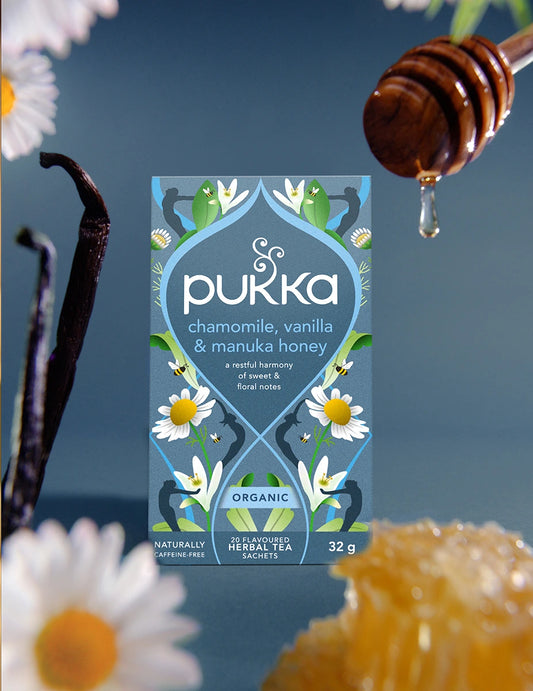 Pukka Chamomile, Vanilla & Manuka Honey tea box with brewed cup