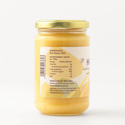 Mellona Raw Honey 400g jar showing ingredients and nutritional information on the label.