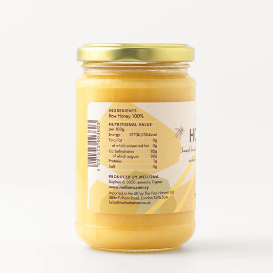 Mellona Raw Honey 400g jar showing ingredients and nutritional information on the label.