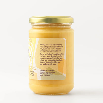 Mellona Raw Honey 400g jar showcasing pure flower honey with details on its natural sourcing.