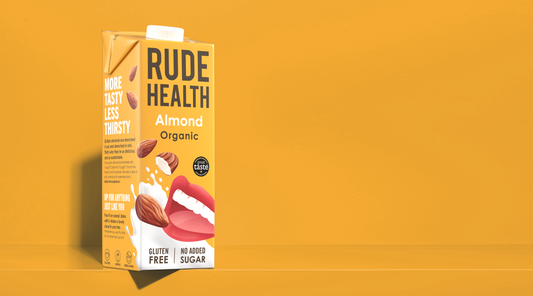 Rude Health Organic Almond Drink poured, lifestyle shot