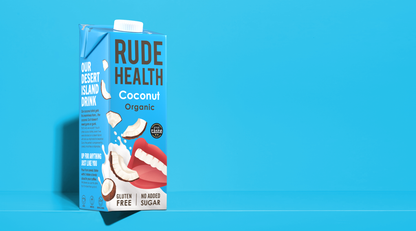 Rude Health Organic Coconut Drink poured, lifestyle shot