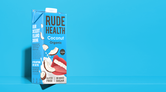 Rude Health Organic Coconut Drink poured, lifestyle shot