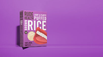 Rude Health Puffed Brown Rice lifestyle shot, bowl with milk