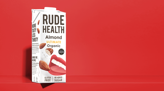 Rude Health Organic Ultimate Almond Drink poured, lifestyle shot